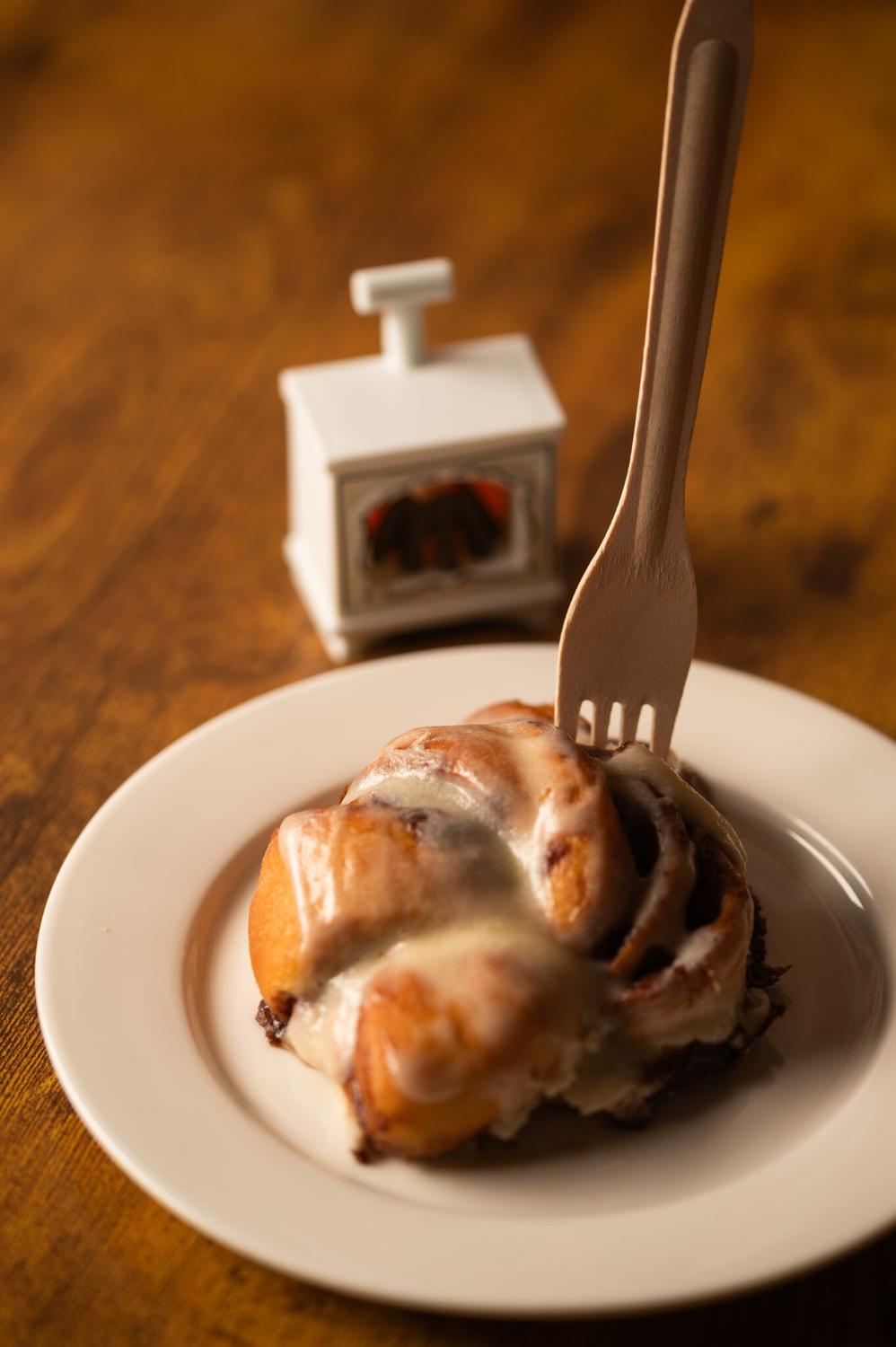 A fork lifting a piece of Cinnamon Scroll