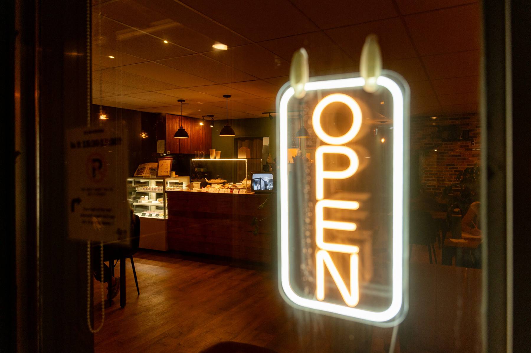 The CozyHaus open sign glowing in the window
